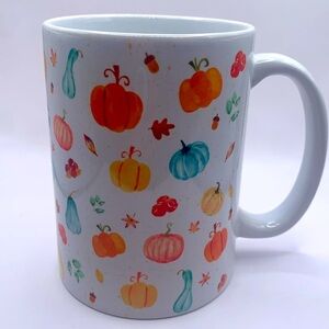 Pumpkin coffee mug. Ceramic large mug with pumpkins and leaves. Fall holiday.